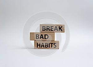 Break bad habits symbol. Concept words Break bad habits on wooden blocks. Beautiful white background. Medicine and Break bad