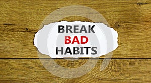 Break bad habits symbol. Words `Break bad habits` on white paper. Beautiful wooden background. Business, psychology and break ba