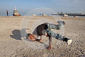 Break dance on the beach of Persian Gulf, southern Iran.