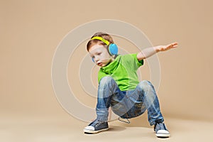 break dance kids. little break dancer showing his skills in dance studio. Hip hop dancer boy performing over studio background