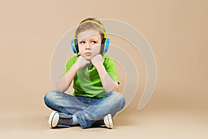 break dance kids. little break dancer showing his skills in dance studio. Hip hop dancer boy performing over studio background