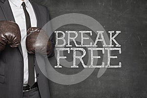 Break free on blackboard with businessman on side