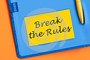 Break the rules the word is written in black letters on the yellow paper for notes