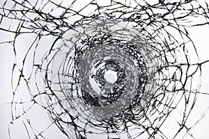 Break through the windshield. Broken glass with a hole from a firearm