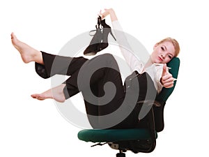 Break from work. Businesswoman relaxing on chair.