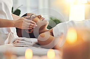 Breakaway from the chaos of everyday. an attractive young woman getting a massage at a spa.