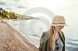 Breakaway and get back to nature. a young woman spending a day at the lake.