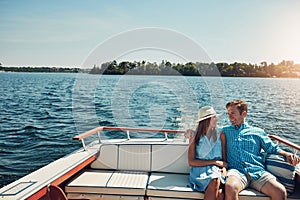 Breakaway and go somewhere beautiful. a young couple spending time together on a yacht.