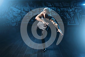 Breakdance motions, performer in dance studio