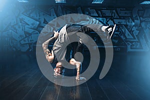 Breakdance motions, performer in dance studio