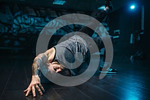 Breakdance motions, performer in dance studio