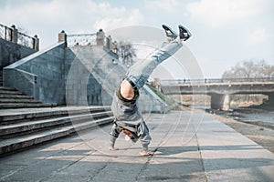 Breakdance performer, upside down motion on street