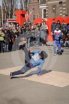 Breakdancer performing in Museumplein in Amsterdam Netherlands. March, 2015.