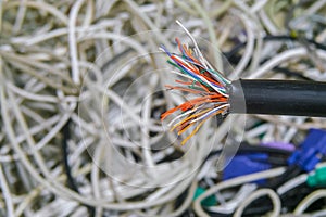 Breakdown of communication equipment. A damaged multi-core cable is close-up. Breakage of the telephone wire. Problems with