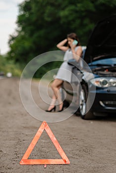 Breakdown, emergency sign, woman calling for help