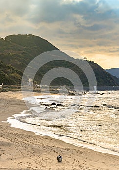 Breaked Plastic buoy stranded on the Sunset Beach with the Sakurai Futamigaura`s Couple Stones.