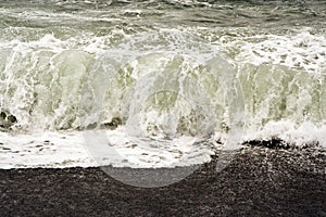 Breakers at a black beach