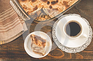 breakfast with apple pie and a cup of black coffee/breakfast with apple pie and a cup of black coffee on a wooden background, top