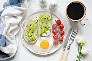 Breakfast avocado toast with egg and coffee cup