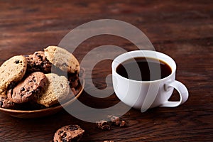 Breakfast background with mug of fresh coffee, homemade oatmeal cookies, grind coffee