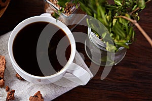 Breakfast background with mug of fresh coffee, homemade oatmeal cookies, grind coffee