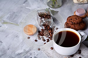 Breakfast background with mug of fresh coffee, homemade oatmeal cookies, grind coffee