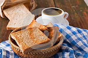 Breakfast background, toast and coffee on rustic wood