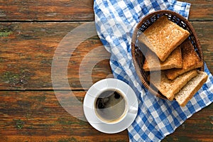 Breakfast background, toast and coffee on rustic wood, top view