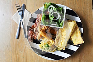 Breakfast of bacon, toast and egg