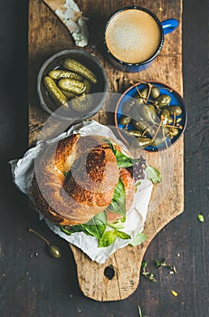 Breakfast with bagel, espresso coffee, capers and pickles