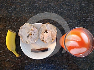 Breakfast With Bagels, Sausage, Bananas, Glass of Juice And A Smile