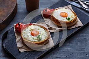 Breakfast with baked cheese and egg yolk filled buns