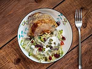 Breakfast with baked chicken and vegetable salad with pumpkin seeds