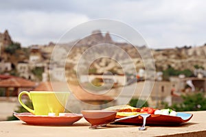 Breakfast on the balcony overlooking Uchisar Mountain in Cappadocia