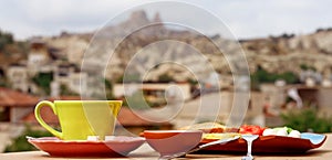 Breakfast on the balcony overlooking Uchisar Mountain in Cappadocia