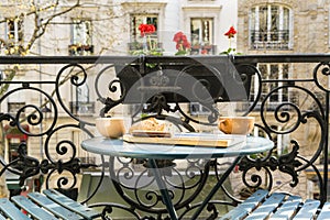 Breakfast on the balcony in Paris in springtime