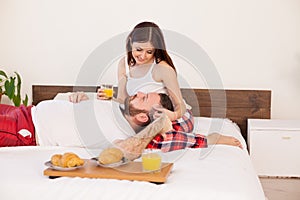 Breakfast in bed a married couple in the morning in the bedroom