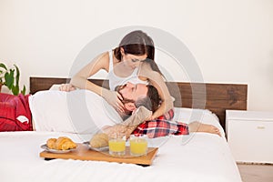 Breakfast in bed a married couple in the morning in the bedroom