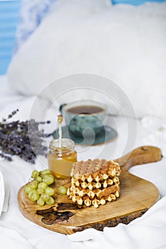 Breakfast with Belgian waffles, apricot jam and coffee