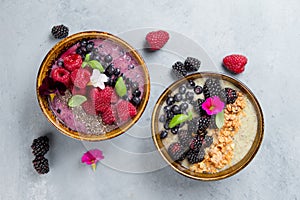 Breakfast berry smoothie bowl topped with berries,