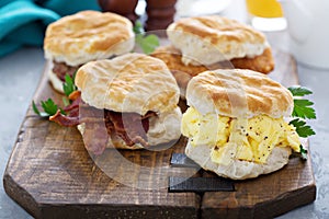 Breakfast biscuits with soft scrambled eggs and bacon photo