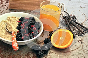 Breakfast with blackberries ,goji seeds and orange juice