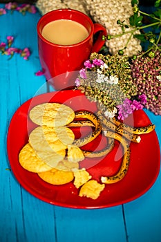 Breakfast on a blue wooden background, Cup of latte with cookies