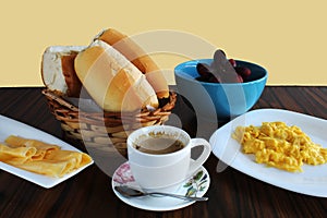 Breakfast in Brazil. Coffee and milk, bread, cheese, eggs and fruits
