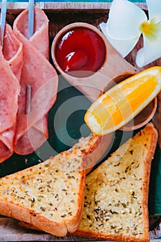 Breakfast with bread, ham, cheese, orange juice