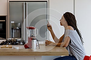 Breakfast break, modern kitchen, red blender, stainless steel pa photo