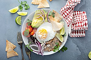 Breakfast burrito bowl with pork carnitas and rice