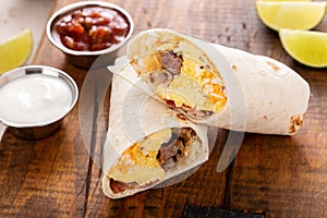 Breakfast burrito with sausage, eggs, hashbrown and cheese