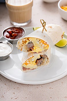 Breakfast burrito with sausage, eggs, hashbrown and cheese