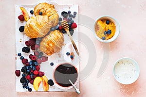Breakfast with  butter croissants, jam and  fresh fruits